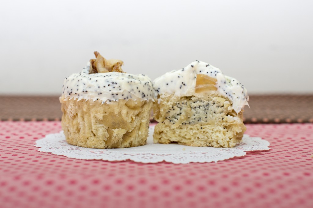 Caramelized Onion cupcake with poppy seed cookie inside topped with poppy seed cream cheese frosting