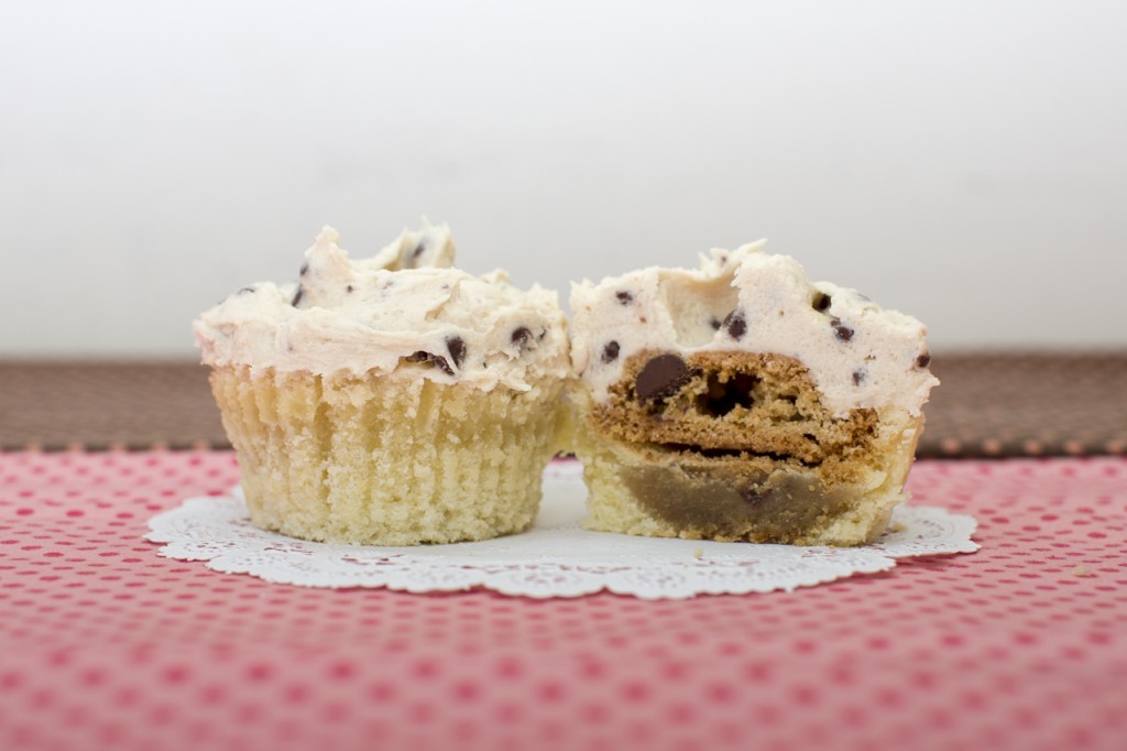 Vanilla cupcake with chocolate chip cookie inside topped with chocolate chip cookie dough buttercream