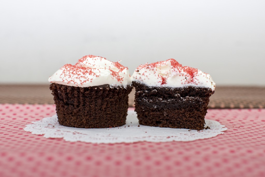 Devil’s food cupcake with mint chocolate chip cookie inside topped with white chocolate peppermint buttercream